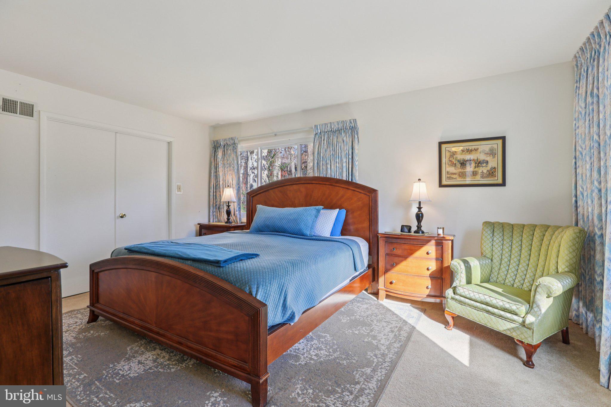 10968 Swansfield Road Columbia, MD 21044 - Photo 36 of 57 a bedroom with a bed and a couch