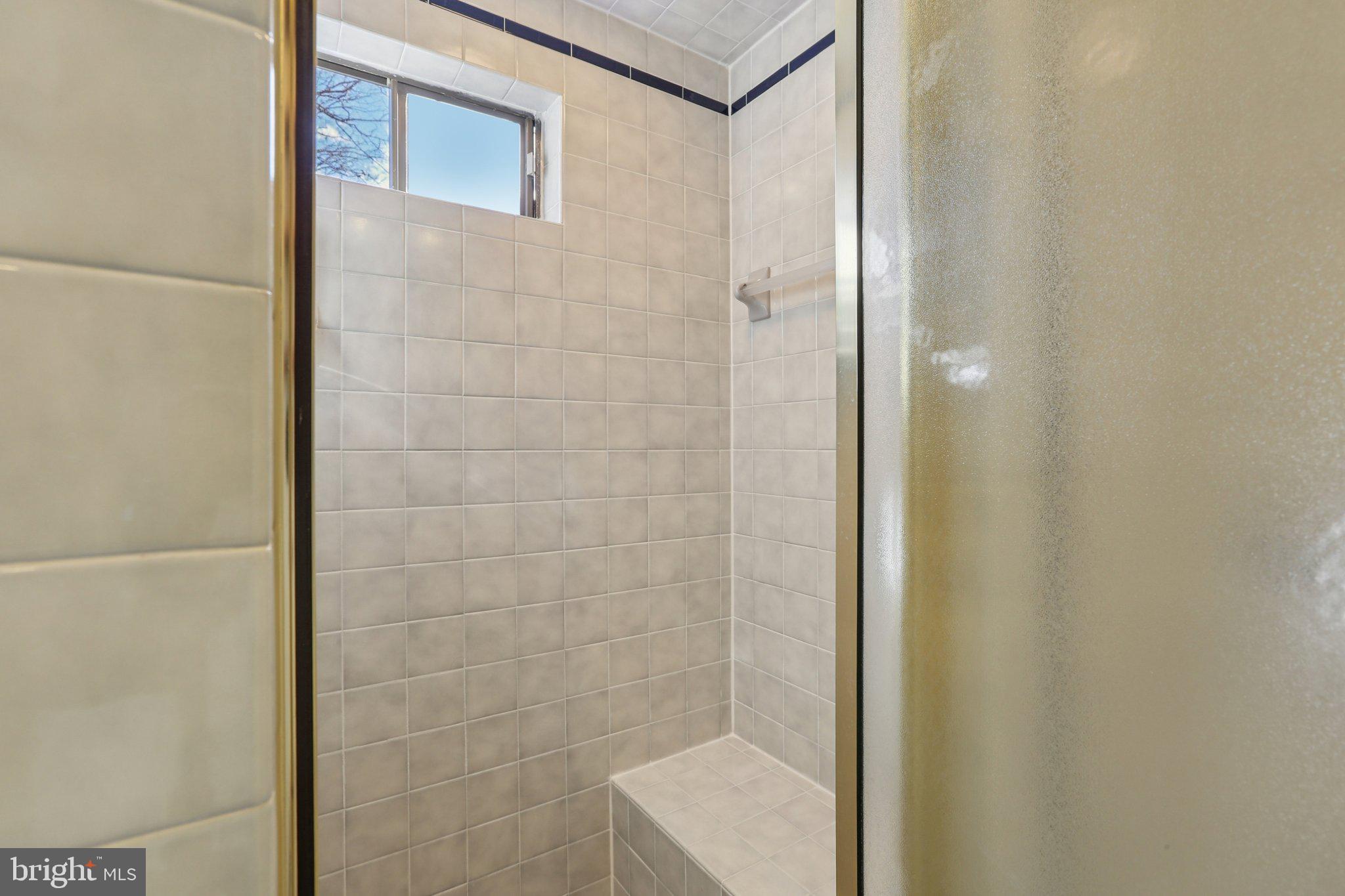 10968 Swansfield Road Columbia, MD 21044 - Photo 40 of 57 a bathroom with a shower and a sink