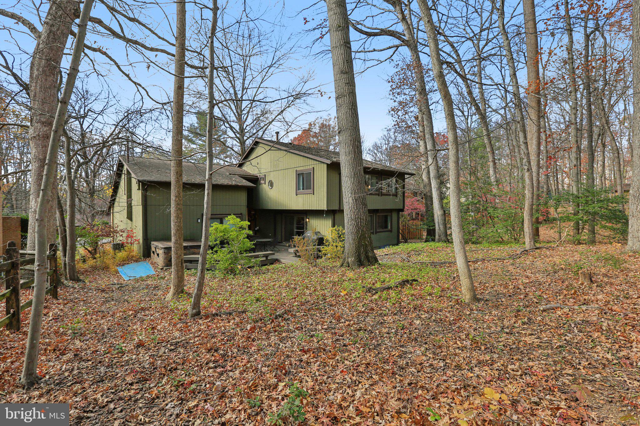 10968 Swansfield Road Columbia, MD 21044 - Photo 50 of 57 a view of a house with a yard and a tree