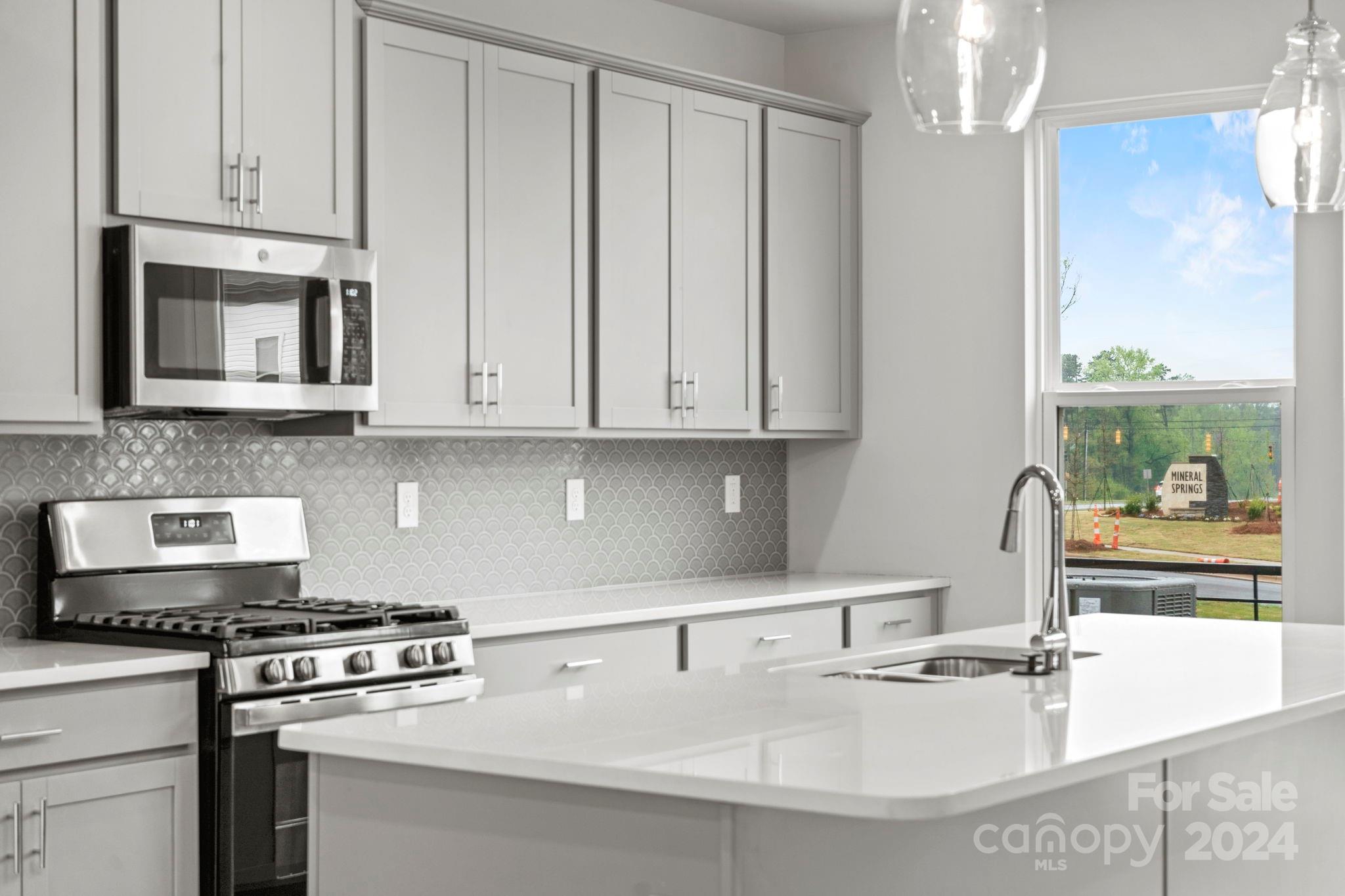 1702 Blanche Street Albemarle, NC 28001 - Photo 1 of 29 a kitchen with stainless steel appliances granite countertop a sink stove and cabinets