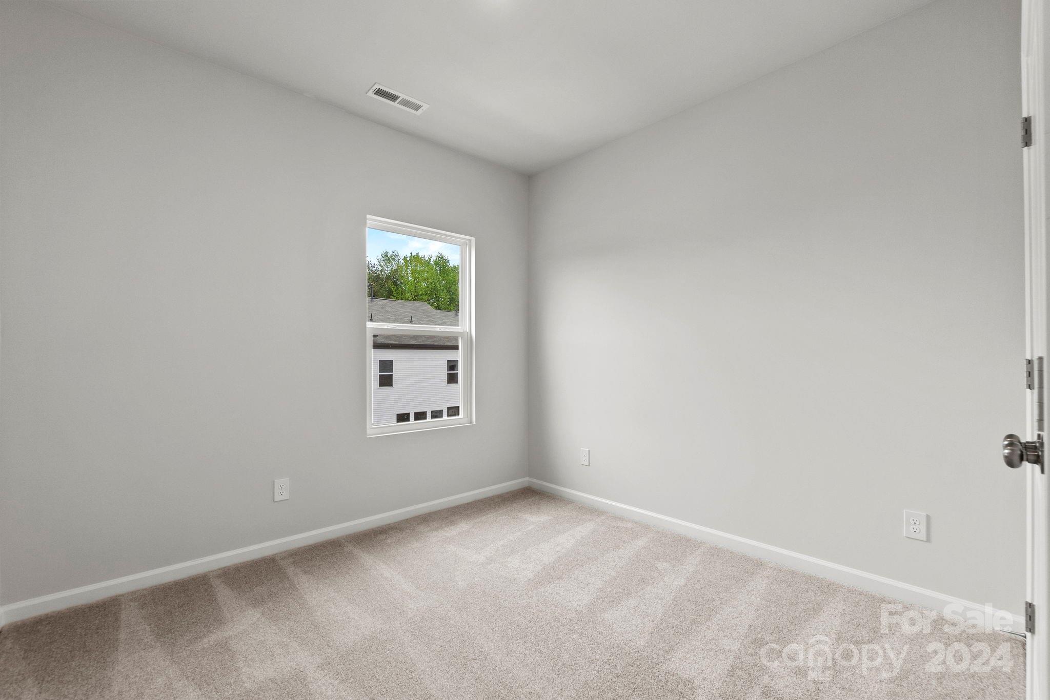 1702 Blanche Street Albemarle, NC 28001 - Photo 14 of 29 an empty room with windows