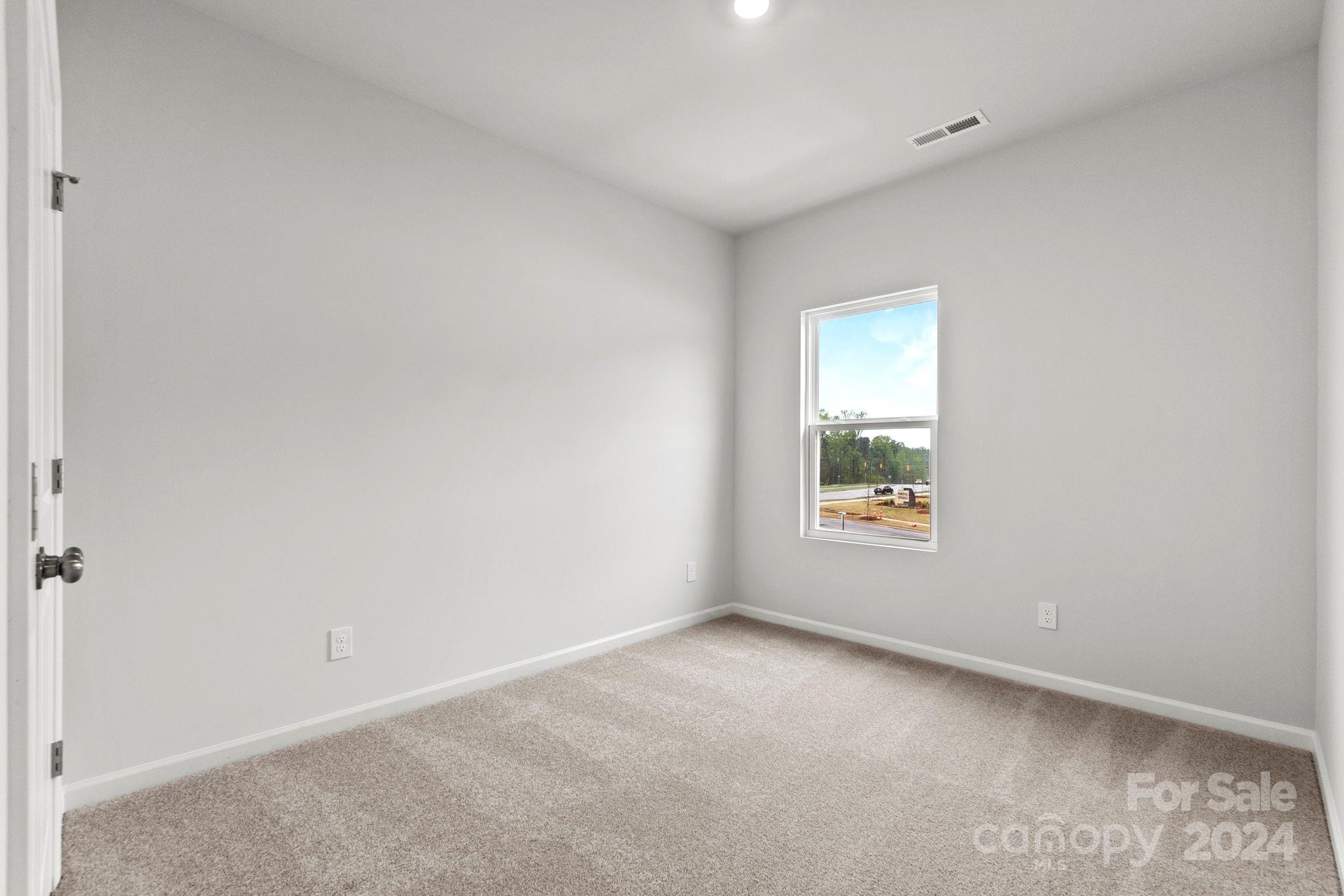 1702 Blanche Street Albemarle, NC 28001 - Photo 17 of 29 an empty room with a window