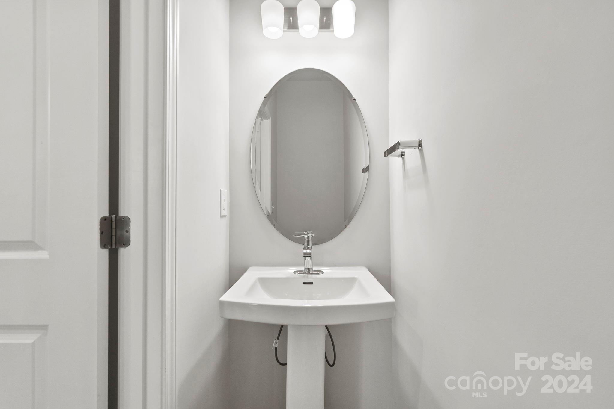 1702 Blanche Street Albemarle, NC 28001 - Photo 23 of 29 a bathroom with a sink and a mirror