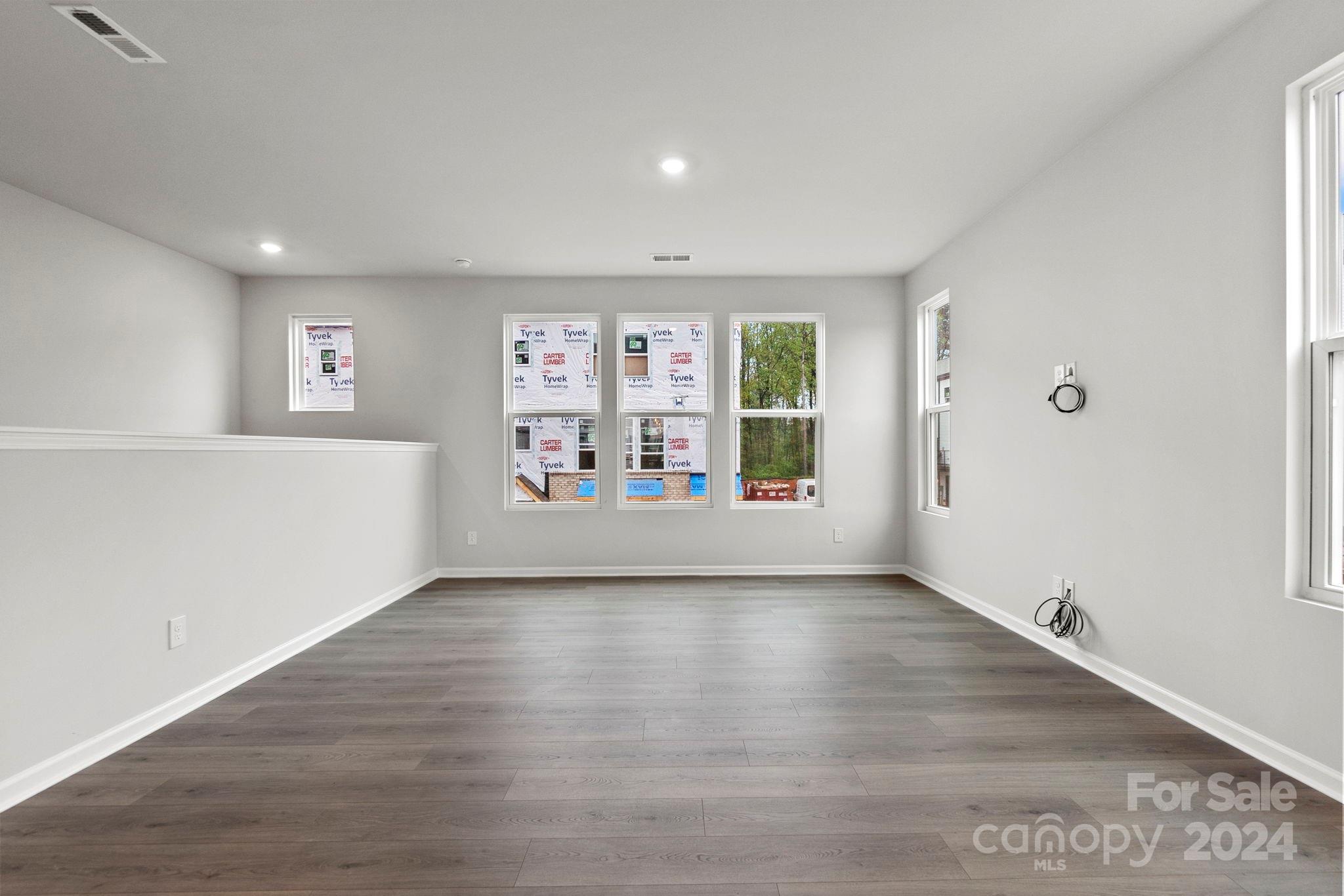 1702 Blanche Street Albemarle, NC 28001 - Photo 8 of 29 wooden floor in an empty room