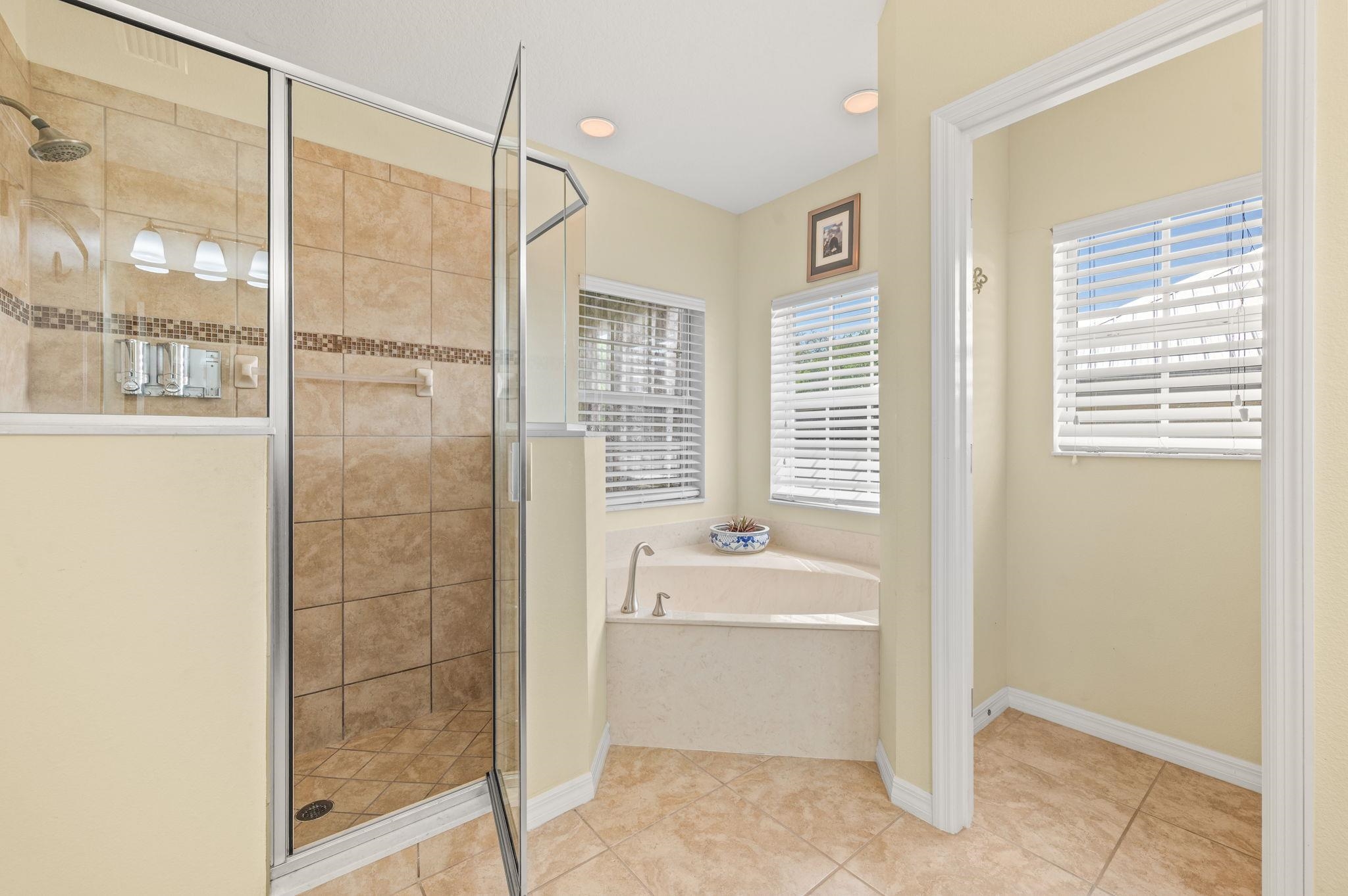 1184 Overdale Road St. Augustine, FL 32080 - Photo 13 of 75 Bathroom with a stall shower, a bath, and light tile patterned flooring