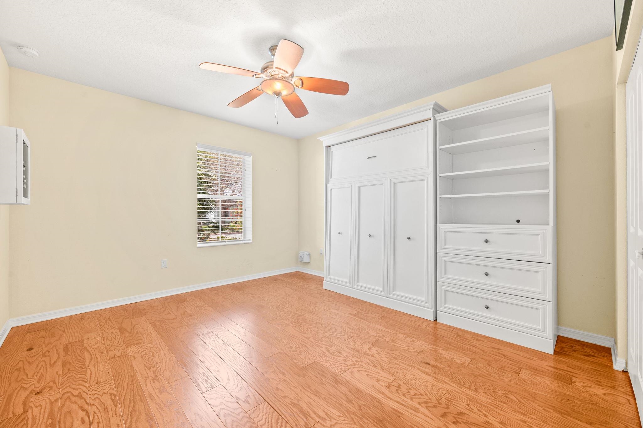 1184 Overdale Road St. Augustine, FL 32080 - Photo 15 of 75 Unfurnished bedroom featuring light wood finished floors, a ceiling fan, and a closet