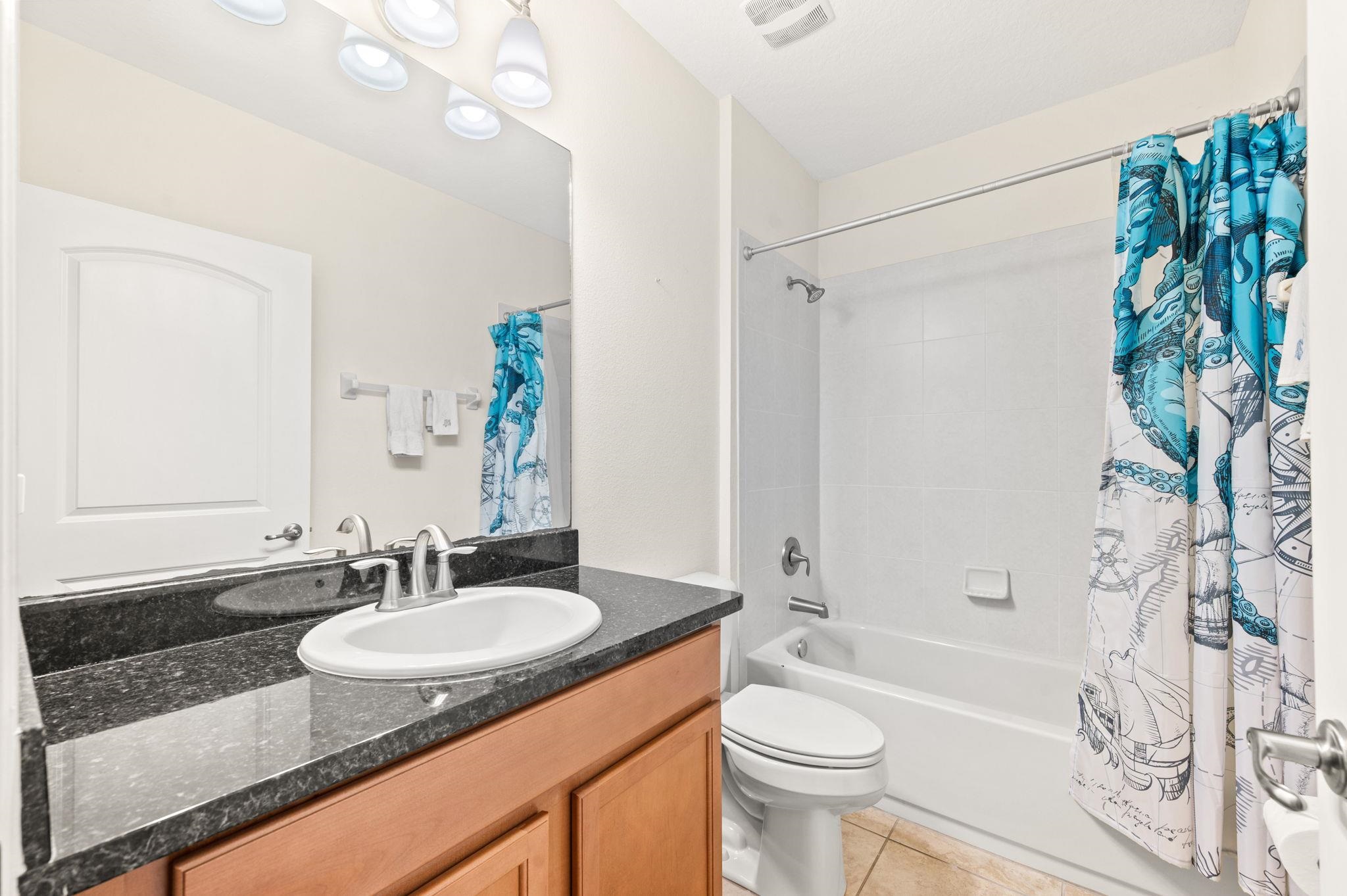 1184 Overdale Road St. Augustine, FL 32080 - Photo 17 of 75 Bathroom with vanity, shower / tub combo with curtain, and light tile patterned floors