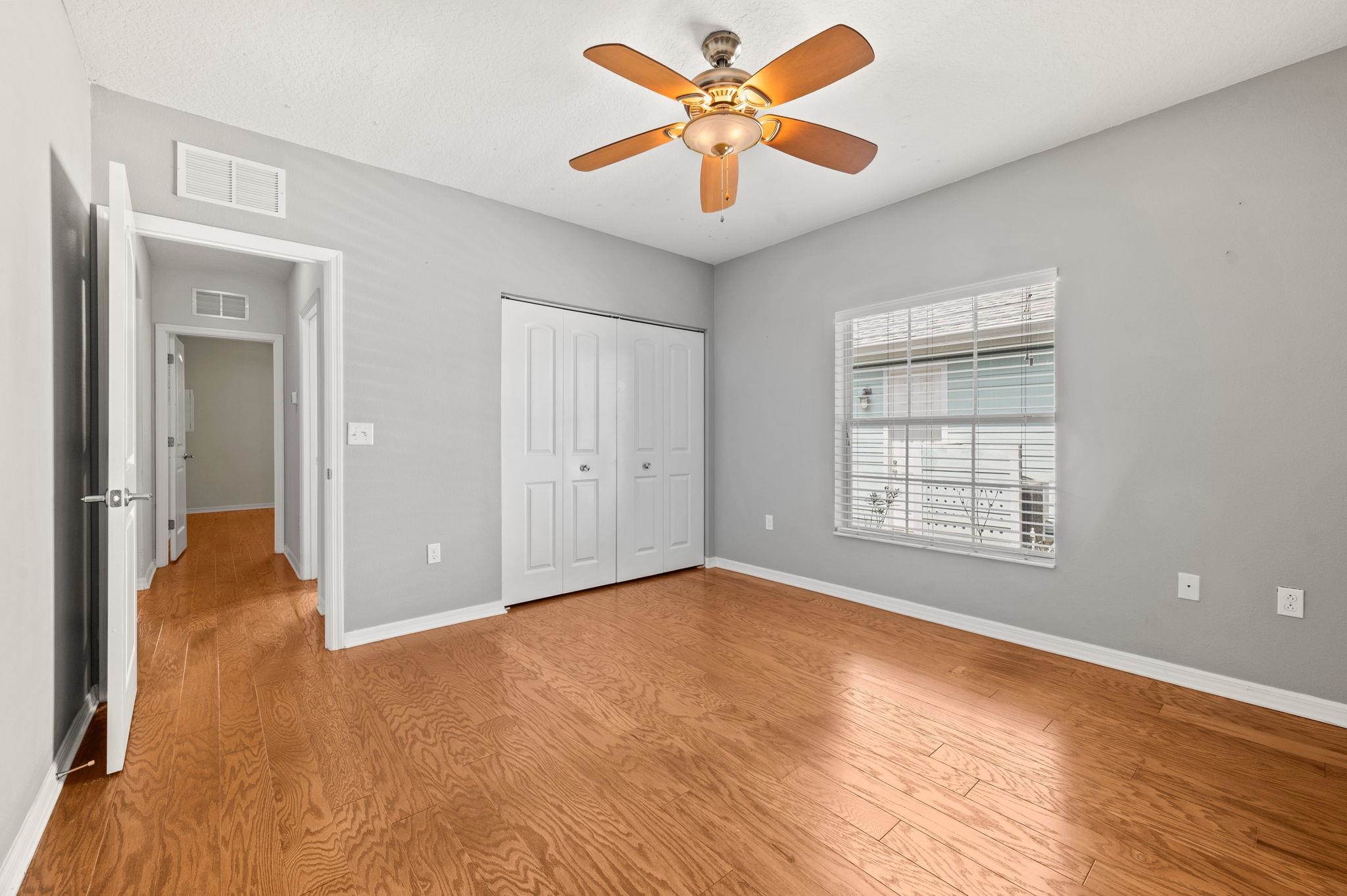 1184 Overdale Road St. Augustine, FL 32080 - Photo 18 of 75 Unfurnished bedroom with a ceiling fan, light wood-style floors, and a closet