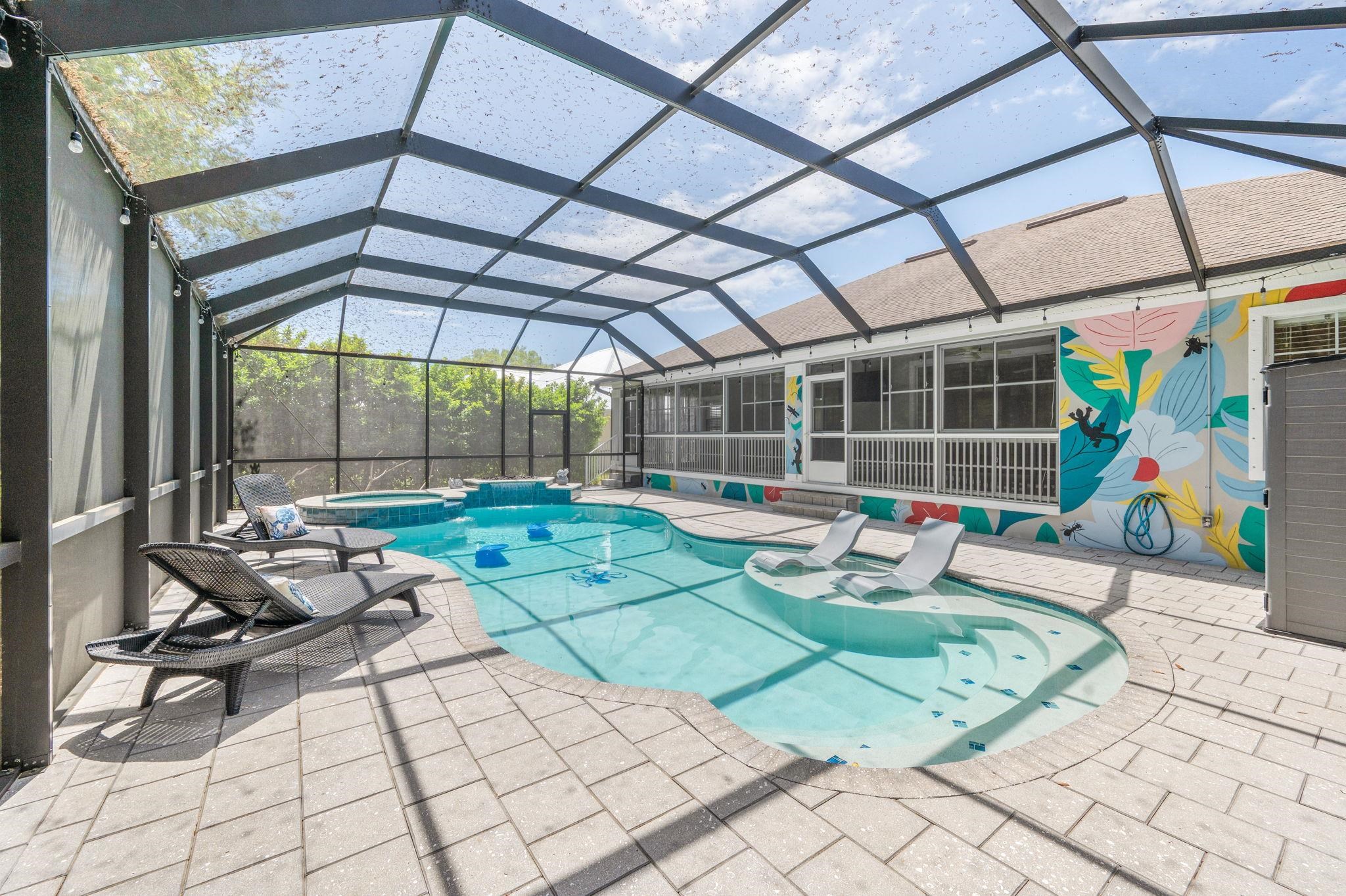 1184 Overdale Road St. Augustine, FL 32080 - Photo 22 of 75 Integrated pool / hot tub featuring a sunroom, a patio area, and a lanai