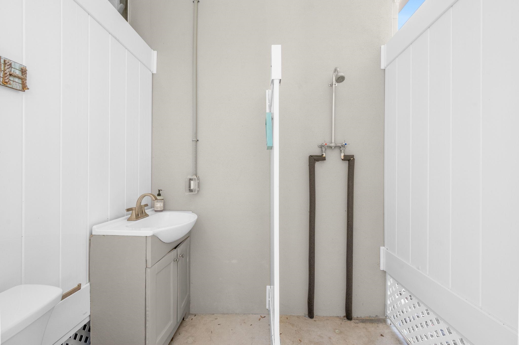 1184 Overdale Road St. Augustine, FL 32080 - Photo 28 of 75 Half bathroom with vanity and unfinished concrete flooring