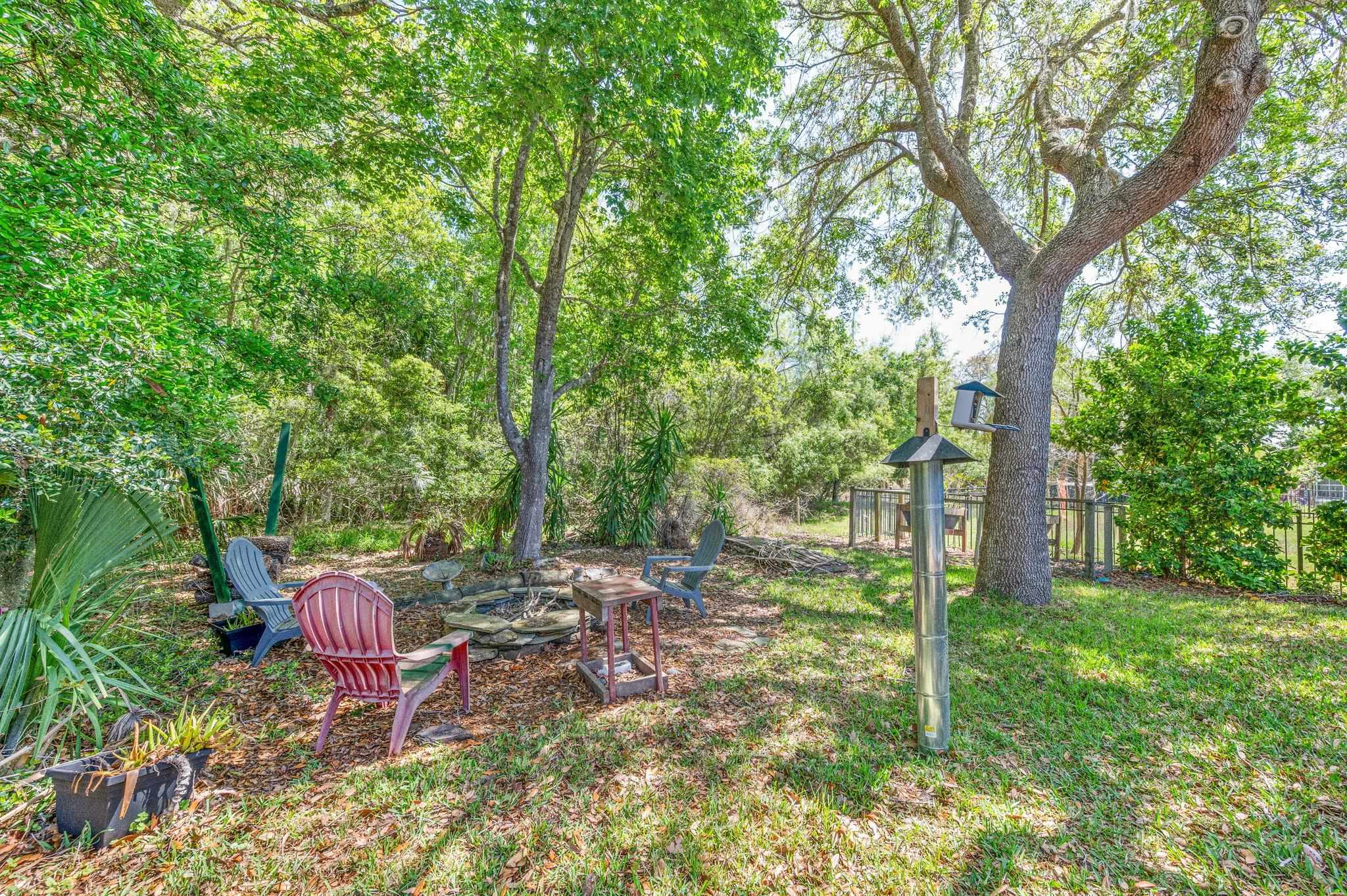1184 Overdale Road St. Augustine, FL 32080 - Photo 30 of 75 View of yard featuring an outdoor fire pit and a patio area