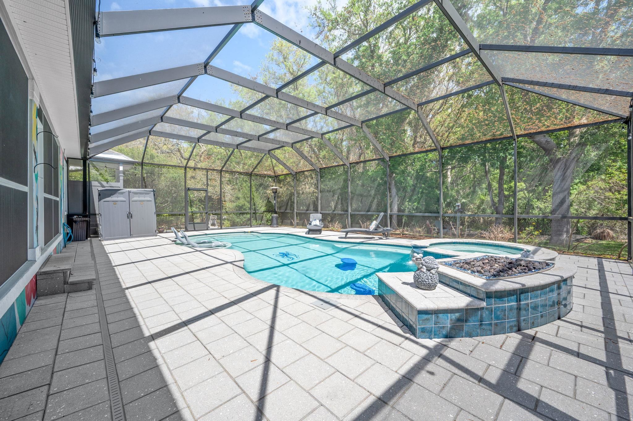 1184 Overdale Road St. Augustine, FL 32080 - Photo 62 of 75 Combined pool / hot tub with a storage unit, a lanai, a sunroom, and a patio