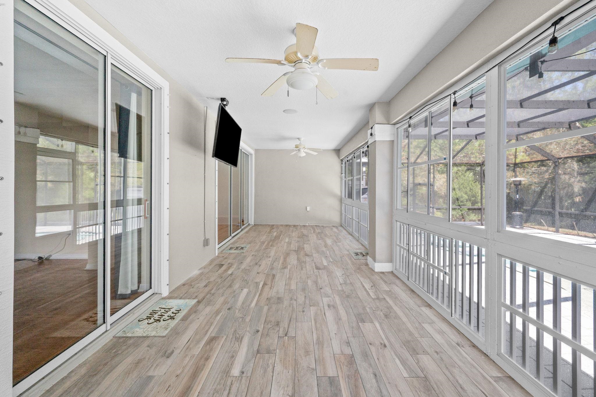 1184 Overdale Road St. Augustine, FL 32080 - Photo 63 of 75 Unfurnished sunroom with plenty of natural light and ceiling fan