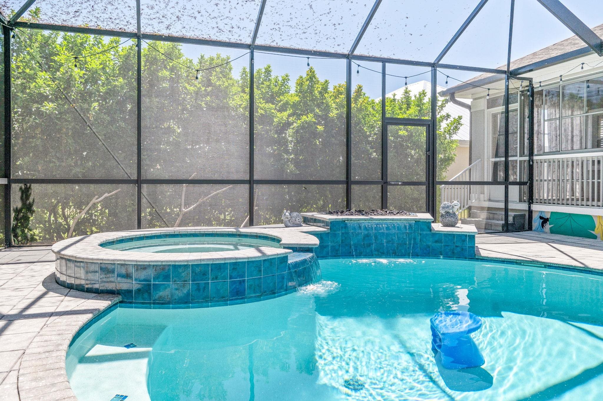 1184 Overdale Road St. Augustine, FL 32080 - Photo 65 of 75 Relaxing pool / spa featuring a sunroom, glass enclosure, and a patio