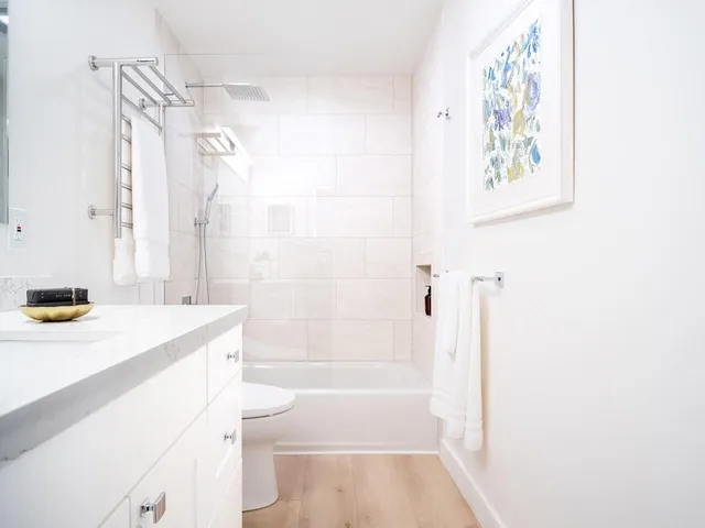 a bathroom with a sink a toilet and a bathtub