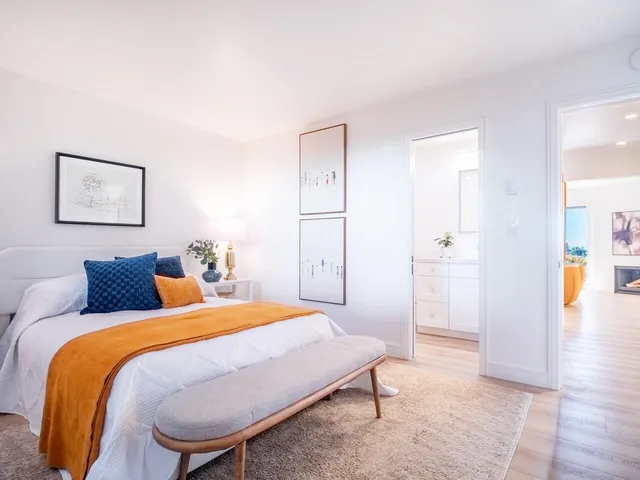 a bedroom with a bed and a table