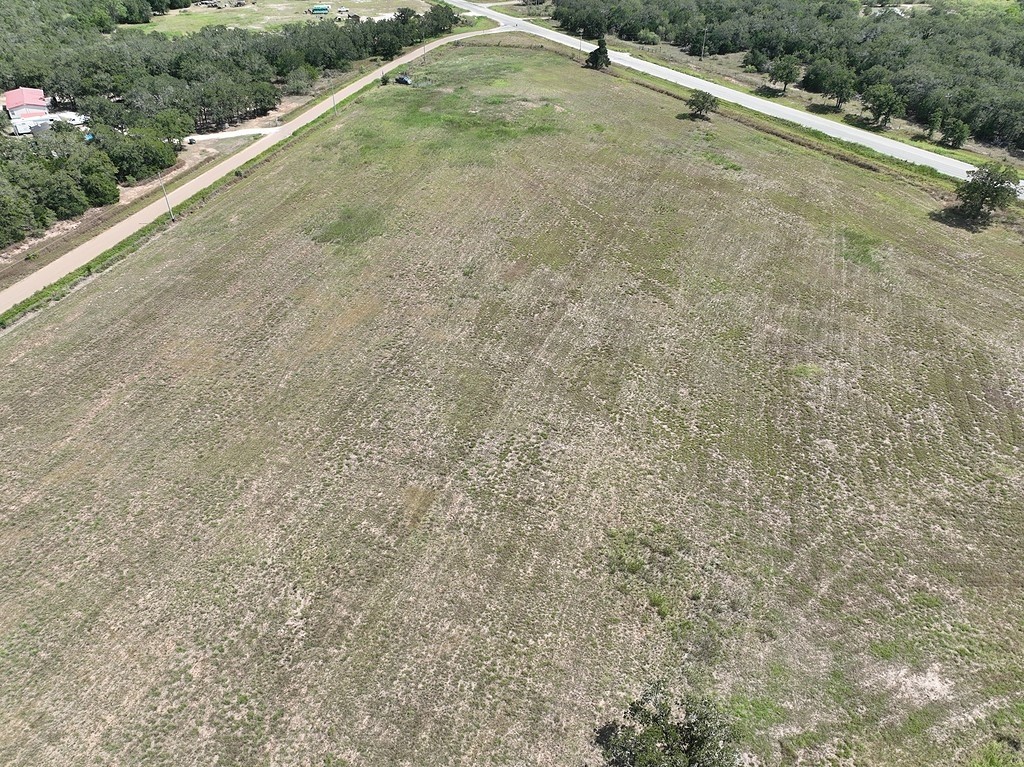 4810 Burke Road Flatonia, TX 78941 - Photo 8 of 18 a view of a dry yard with wooden fence