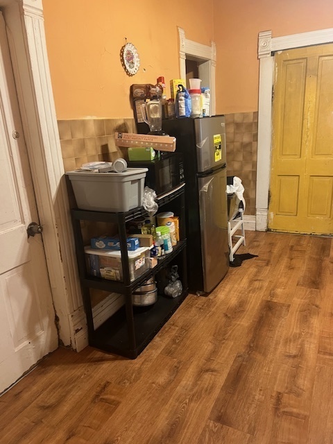 7411 South Morgan Street Chicago, IL 60621 - Photo 4 of 8 a room with water heater and wooden cabinets