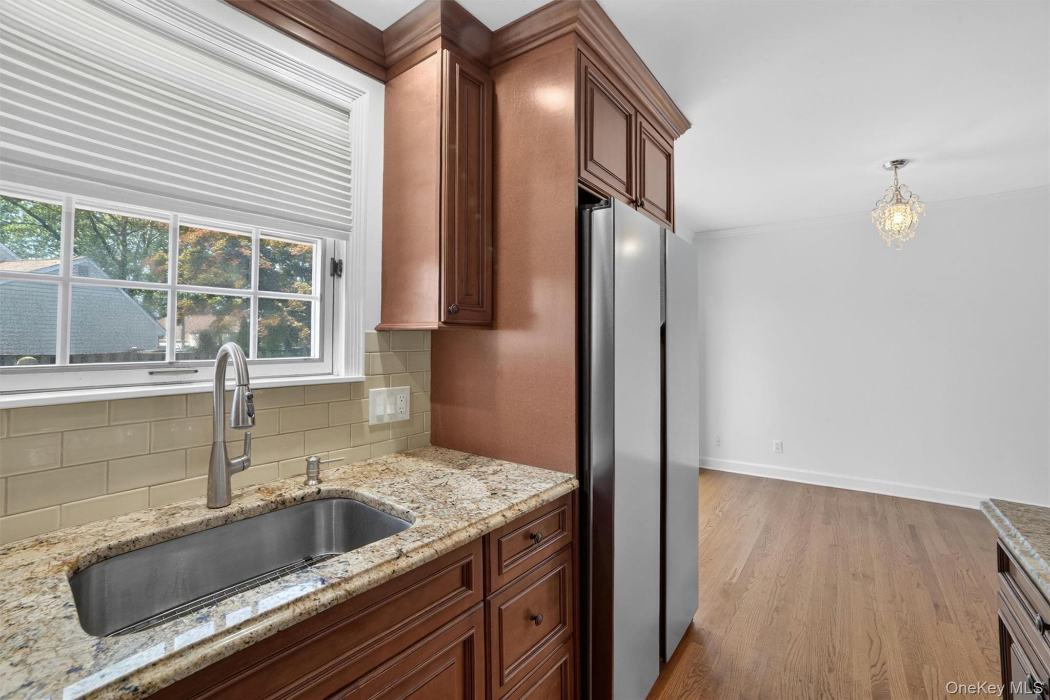 263 Croydon Road Yonkers, NY 10710 - Photo 11 of 43 a kitchen with a sink and a refrigerator