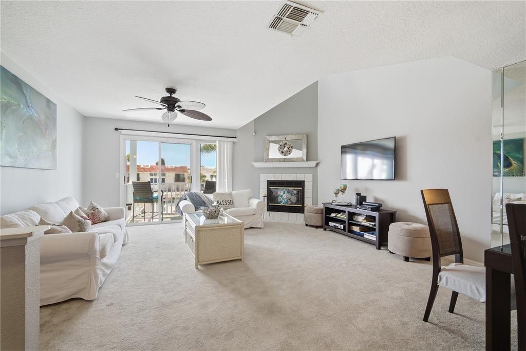 643 Garland Circle Indian Rocks Beach, FL 33785 - Photo 12 of 81 a living room with furniture and a fireplace