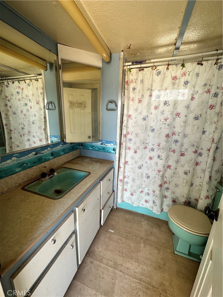1609 Riviera Drive Blythe, CA 92225 - Photo 21 of 40 a bathroom with a sink toilet and shower