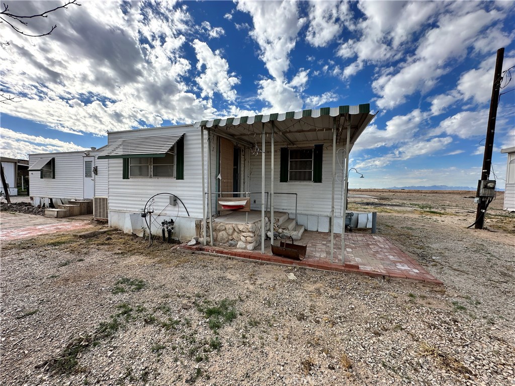 1609 Riviera Drive Blythe, CA 92225 - Photo 10 of 40 a front view of a house with parking space