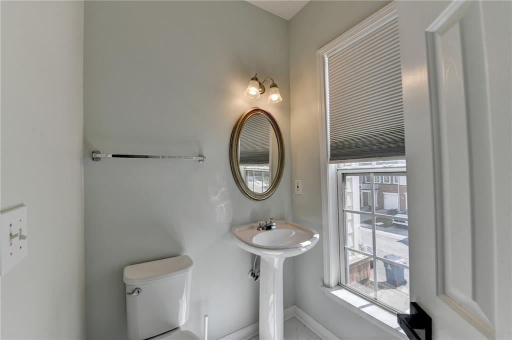 3977 Howell Park Road Duluth, GA 30096 - Photo 16 of 25 a bathroom with a sink and a mirror