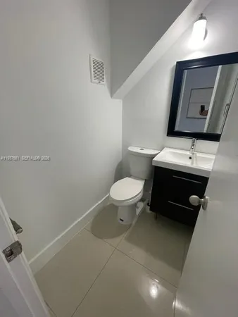 a bathroom with a toilet and a bathtub