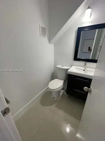 a bathroom with a toilet and a bathtub