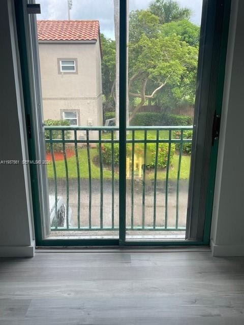 11490 Southwest 148th Court Miami, FL 33196 - Photo 16 of 21 a view of a glass door with a balcony
