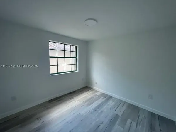 a bathroom with a sink toilet and mirror