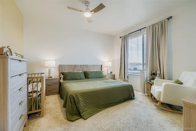 a bedroom with a bed and a mirror