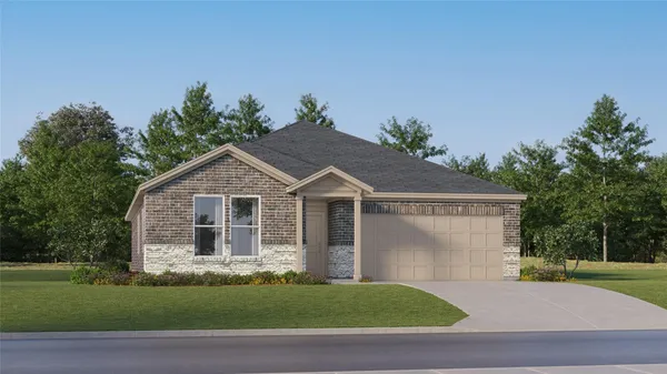 a front view of a house with a garden and yard