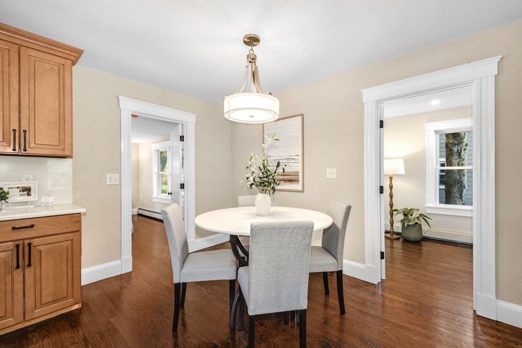 533 Edgell Road Framingham, MA 01701 - Photo 11 of 36 a view of a a dining room with furniture window and wooden floor