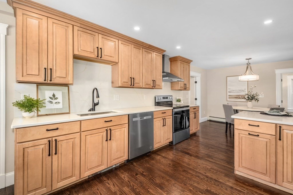 533 Edgell Road Framingham, MA 01701 - Photo 13 of 36 a kitchen with granite countertop white cabinets and white appliances