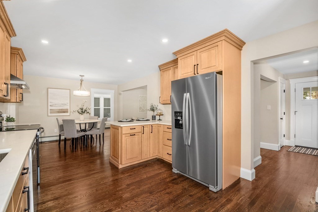533 Edgell Road Framingham, MA 01701 - Photo 14 of 36 a kitchen with stainless steel appliances granite countertop a refrigerator microwave and wooden floor