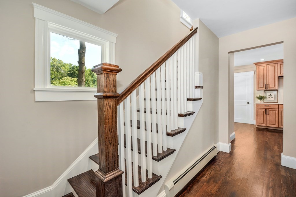 533 Edgell Road Framingham, MA 01701 - Photo 22 of 36 a view of entryway with wooden floor and stairs