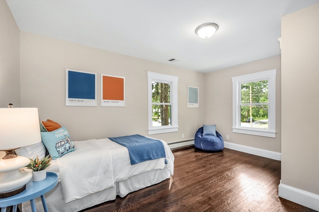 533 Edgell Road Framingham, MA 01701 - Photo 23 of 36 a bedroom with a bed and wooden floor