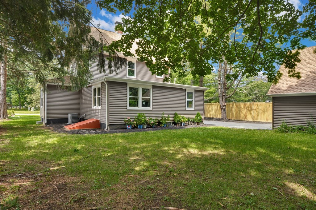 533 Edgell Road Framingham, MA 01701 - Photo 29 of 36 a view of a house with backyard and a tree