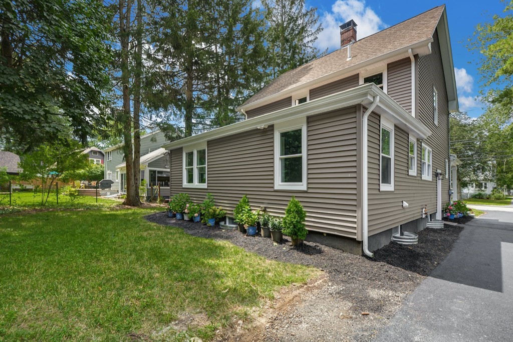 533 Edgell Road Framingham, MA 01701 - Photo 32 of 36 a front view of a house with garden