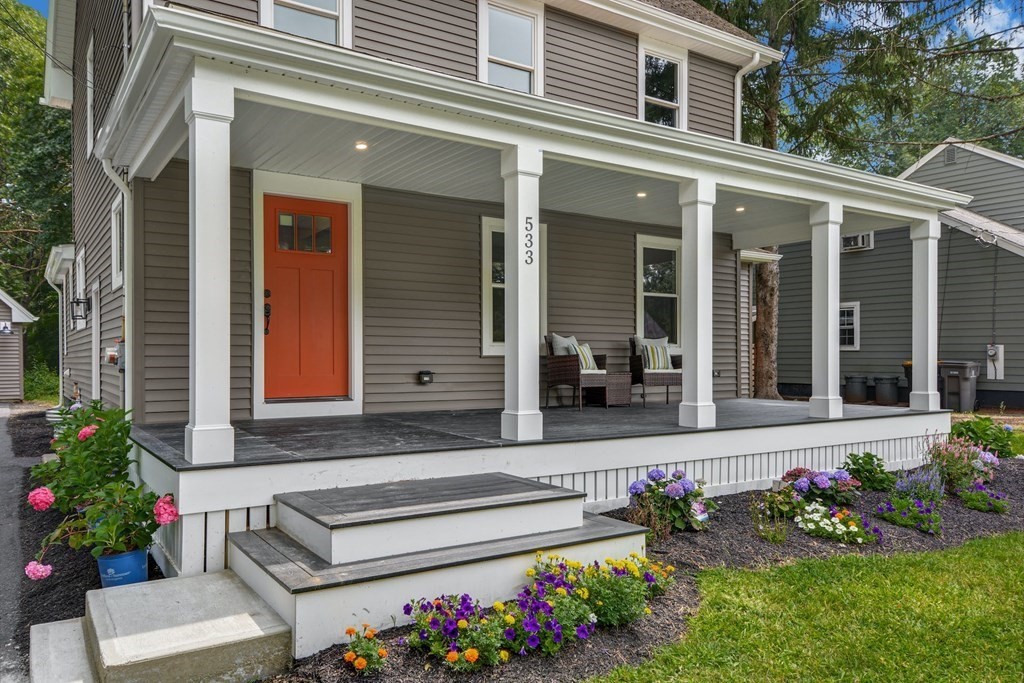 533 Edgell Road Framingham, MA 01701 - Photo 33 of 36 front view of a house with a potted plant