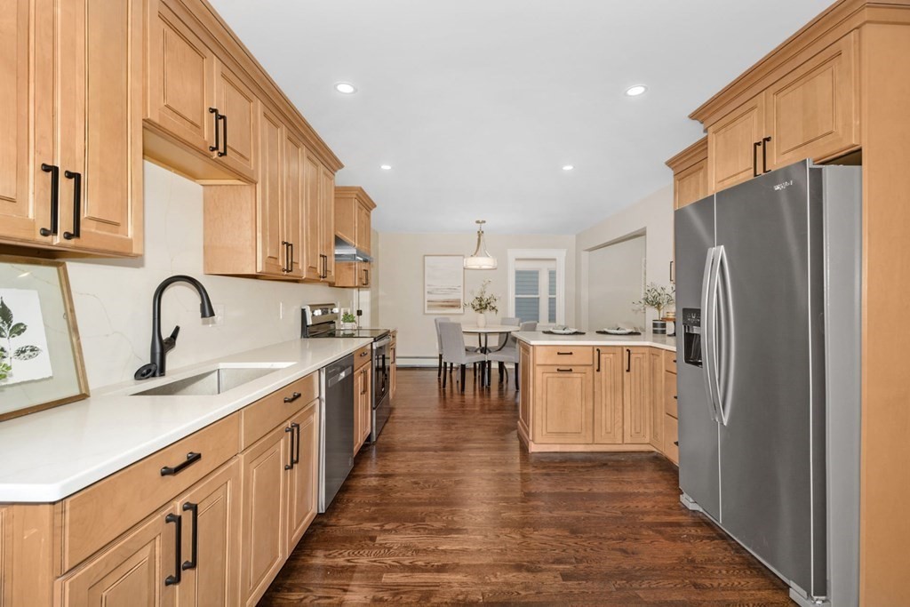 533 Edgell Road Framingham, MA 01701 - Photo 5 of 36 a kitchen with stainless steel appliances a refrigerator sink and cabinets