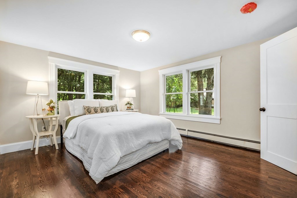 533 Edgell Road Framingham, MA 01701 - Photo 6 of 36 a large bed sitting in a bedroom next to a window