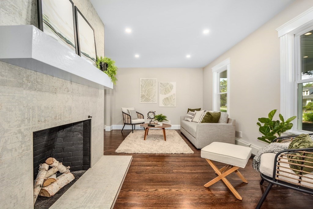 533 Edgell Road Framingham, MA 01701 - Photo 9 of 36 a living room with furniture and a fireplace