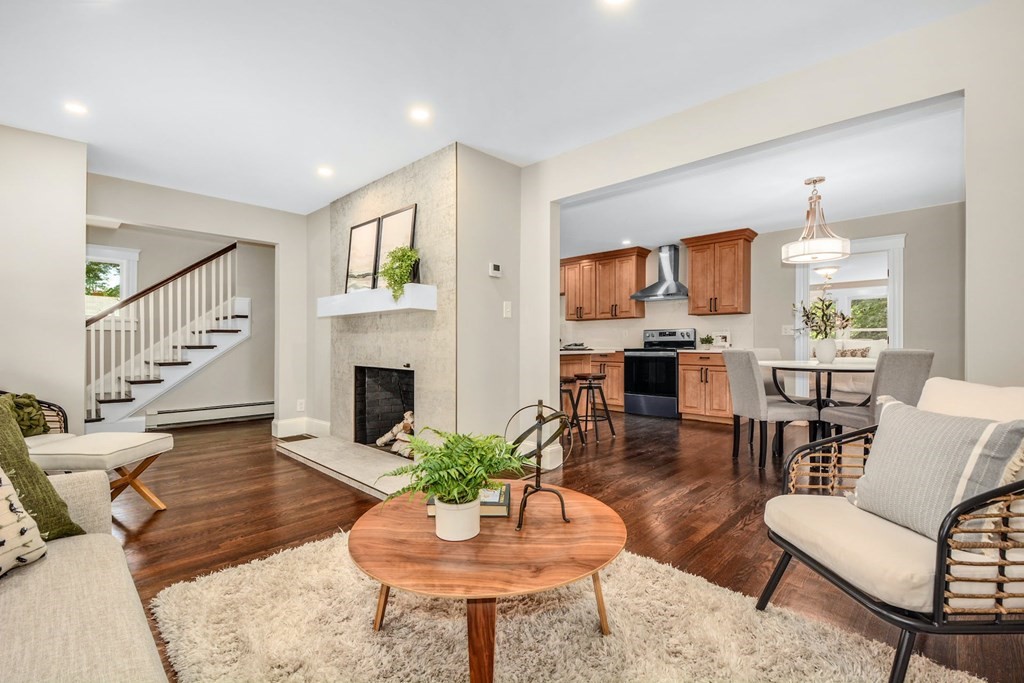 533 Edgell Road Framingham, MA 01701 - Photo 10 of 36 a living room with furniture a fireplace and a flat screen tv
