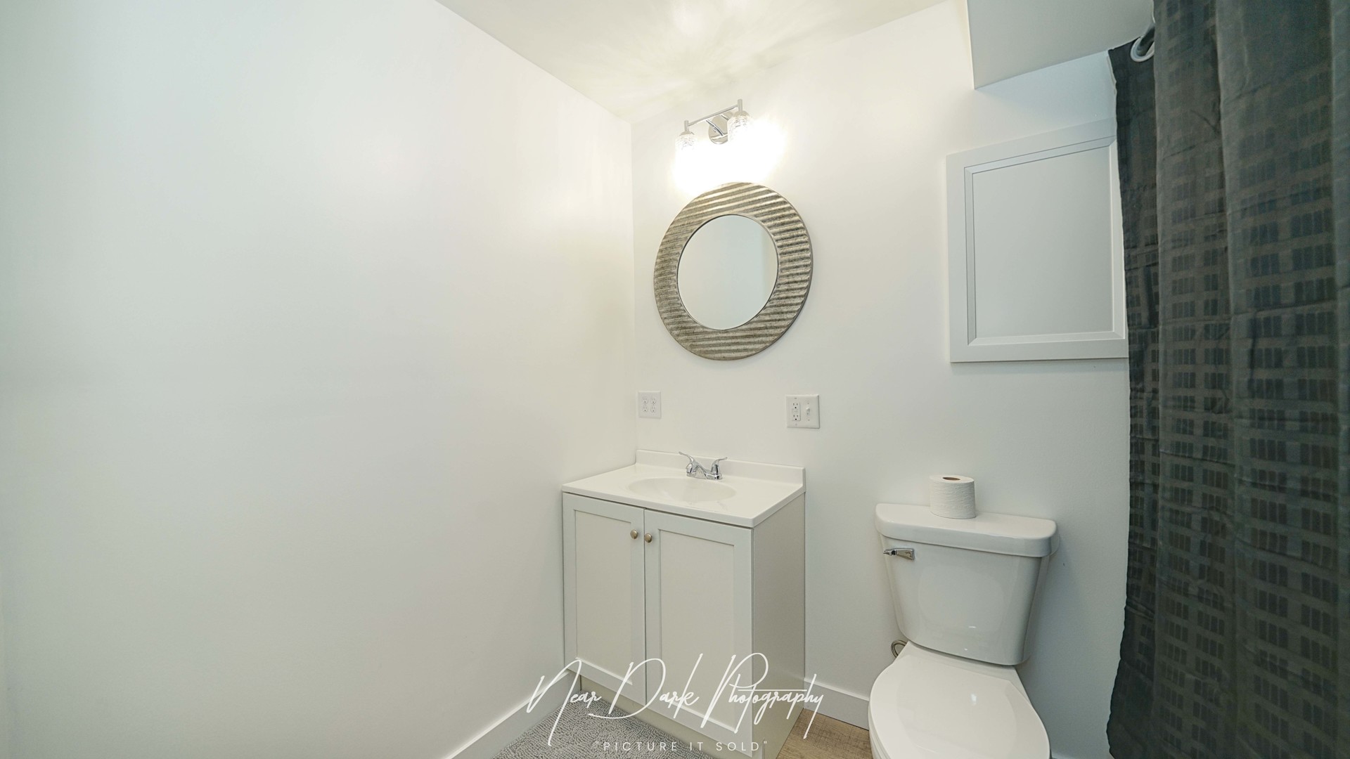 34966 North Forest Avenue Ingleside, IL 60041 - Photo 21 of 46 a bathroom with a toilet a sink and mirror