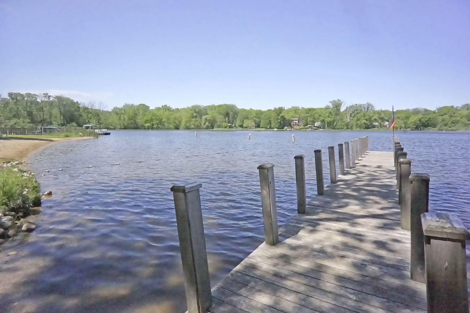 34966 North Forest Avenue Ingleside, IL 60041 - Photo 44 of 46 a view of a lake with houses in the back