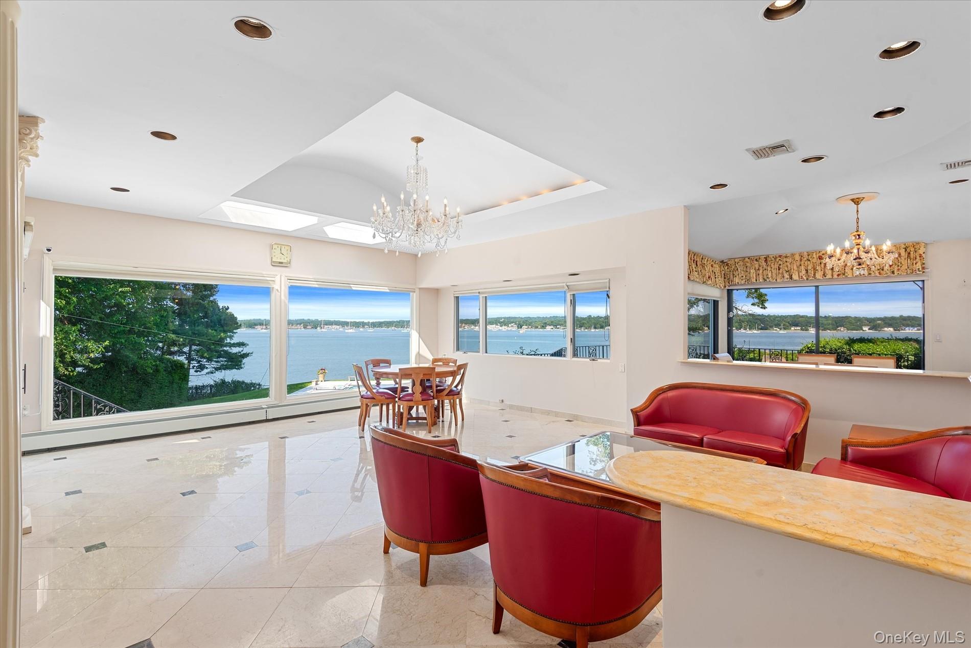 512 East Shore Road Great Neck, NY 11024 - Photo 14 of 46 a outdoor dining space with furniture and outdoor view