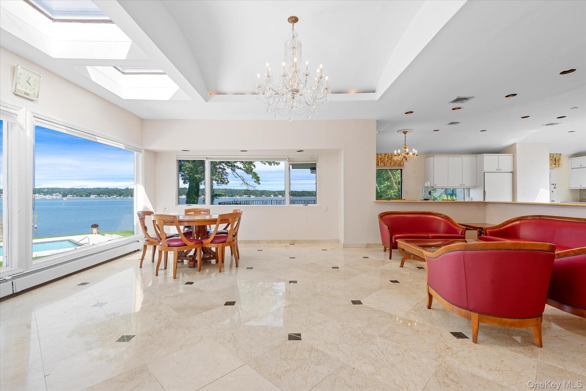 512 East Shore Road Great Neck, NY 11024 - Photo 16 of 46 a dining room with furniture and a large window