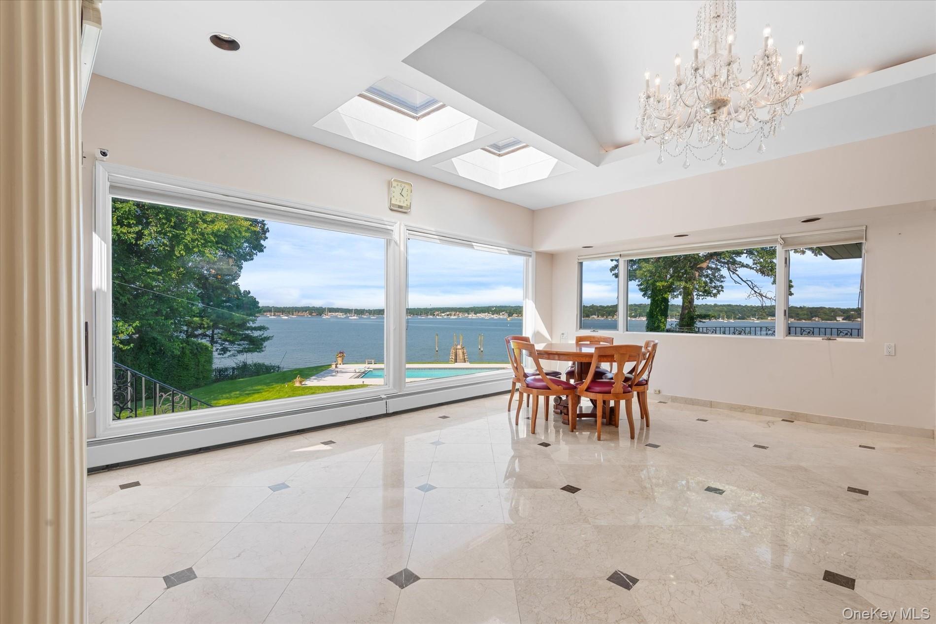 512 East Shore Road Great Neck, NY 11024 - Photo 17 of 46 a view of a dining room with furniture window and outside view